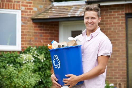 Workers managing builders waste on site