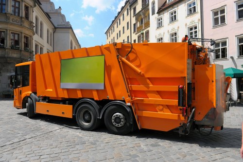 Lorry and bins during a commercial waste collection in Purley